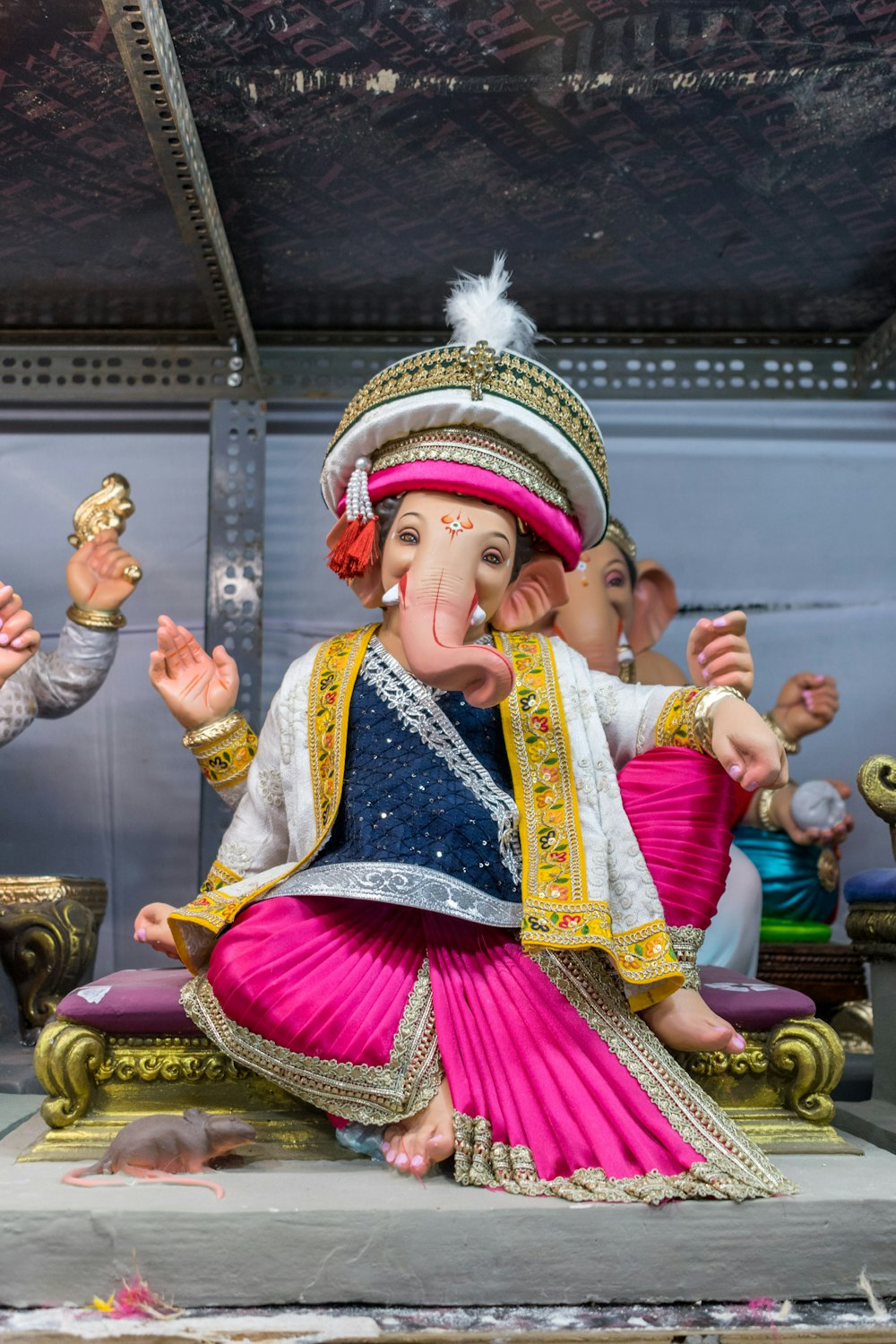 a statue of an elephant sitting on top of a table