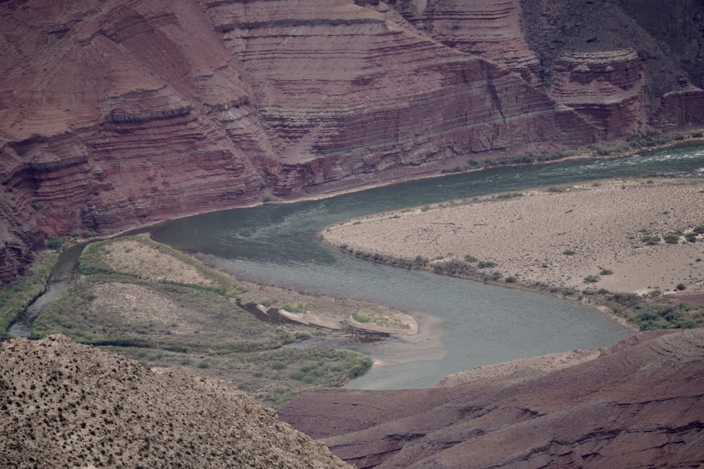 a river running through a canyon surrounded by mountains