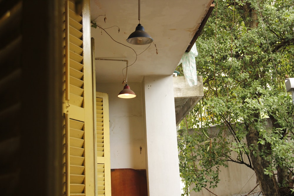 a lamp hanging from the side of a building