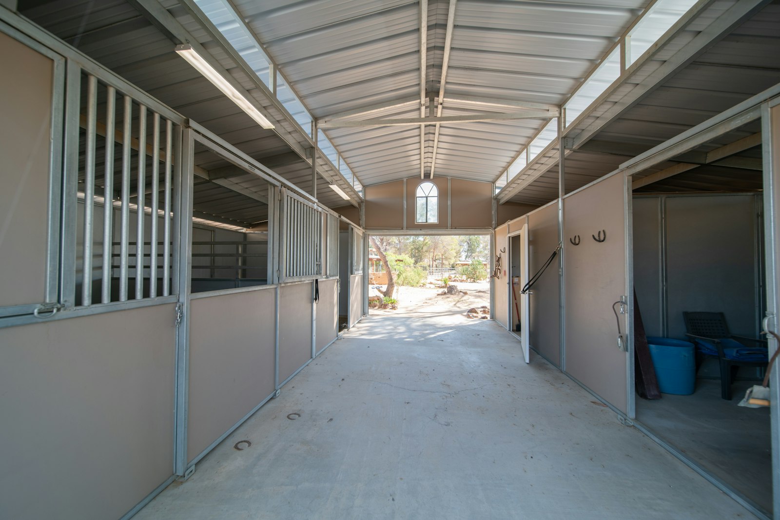 The aisle of a horse barn