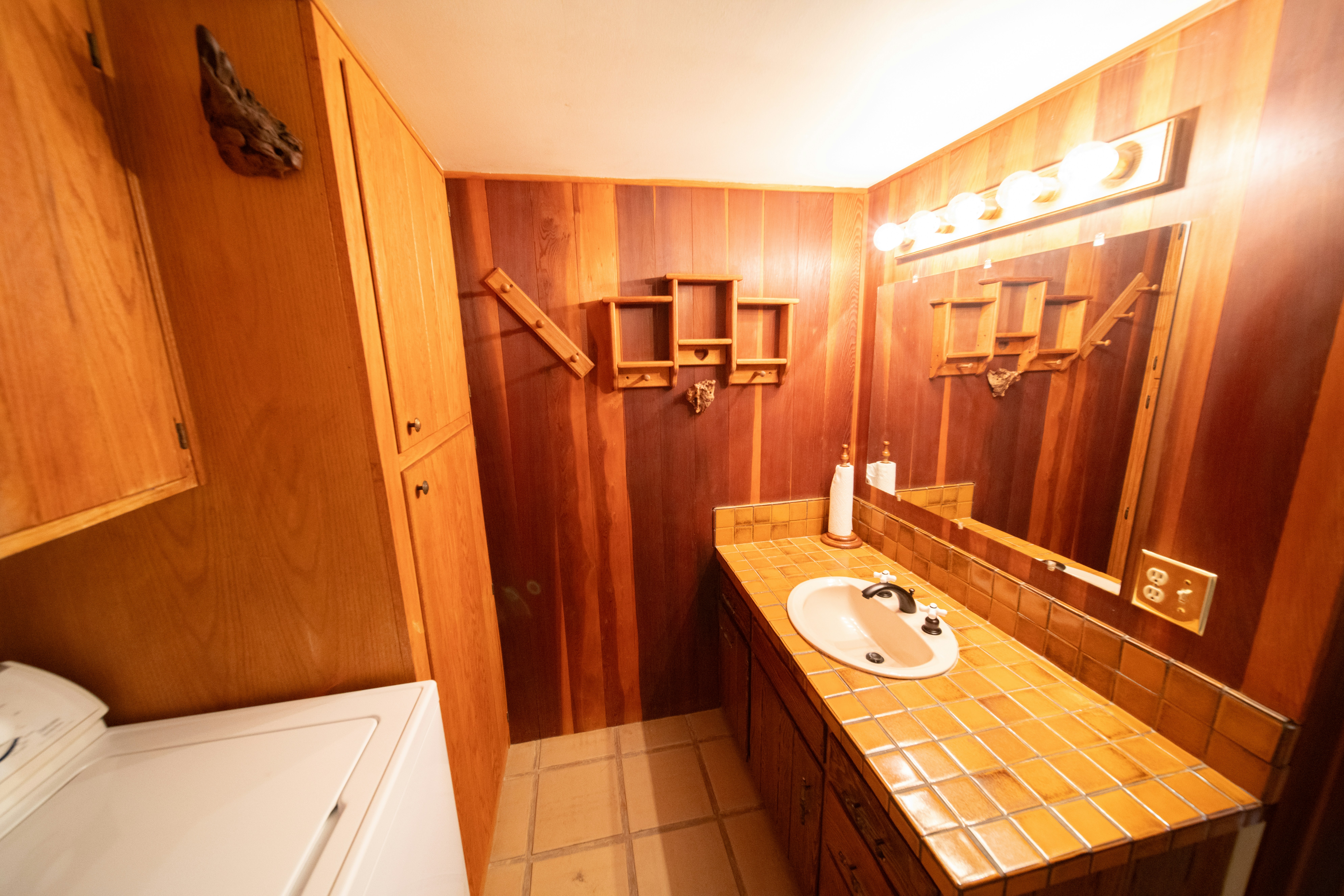 a bathroom with a washer and dryer in it
