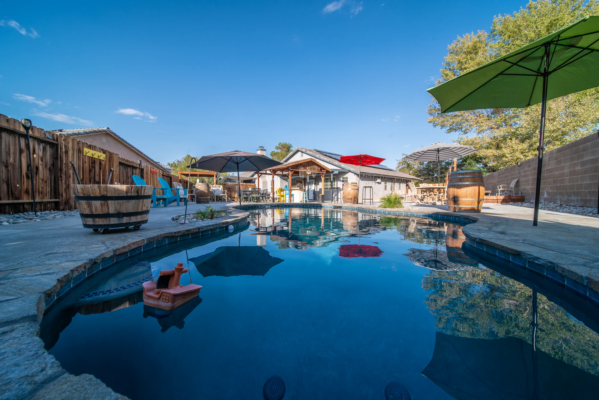 An empty backyard swimming pool sitting unused