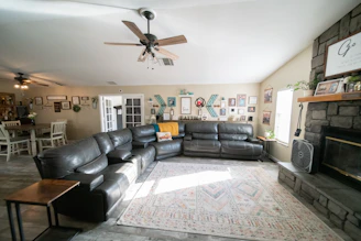 a living room filled with furniture and a fire place