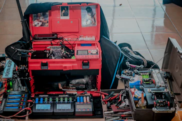 A cozy electronics workshop with tools, circuit boards, and green plants symbolizing sustainability.