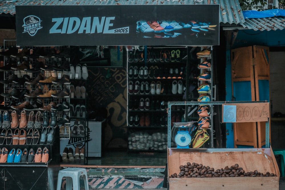 a store front with lots of shoes on display