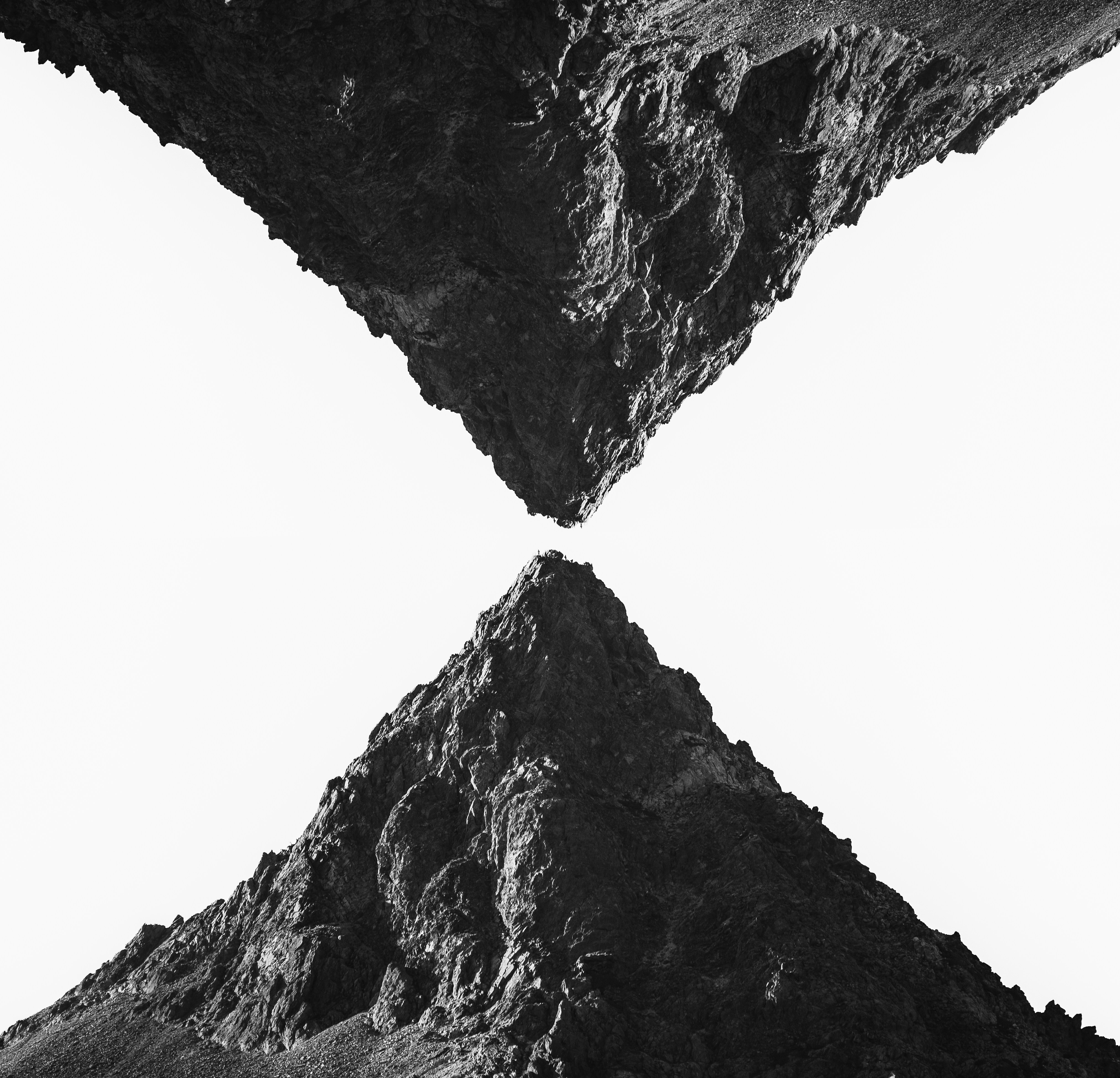 a black and white photo of a mountain