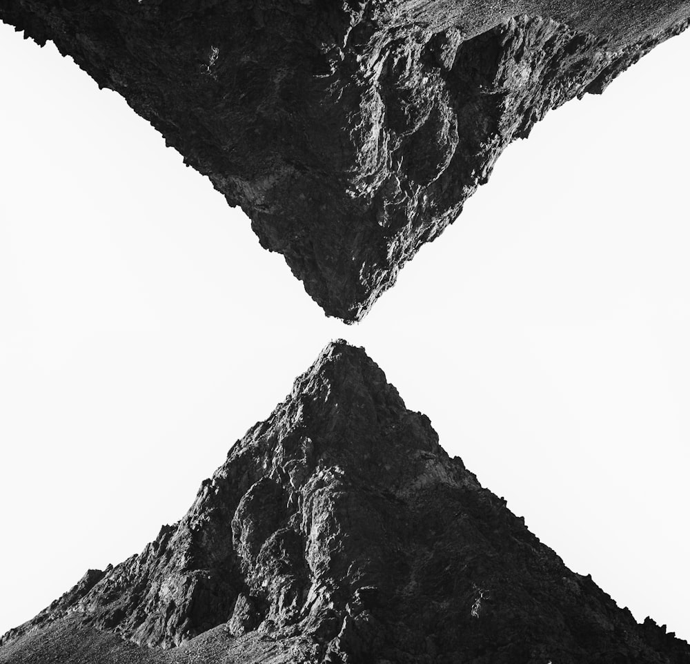 a black and white photo of a mountain