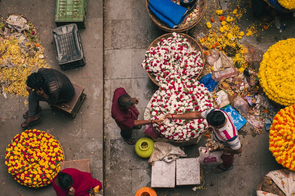 a group of people working in a flower market