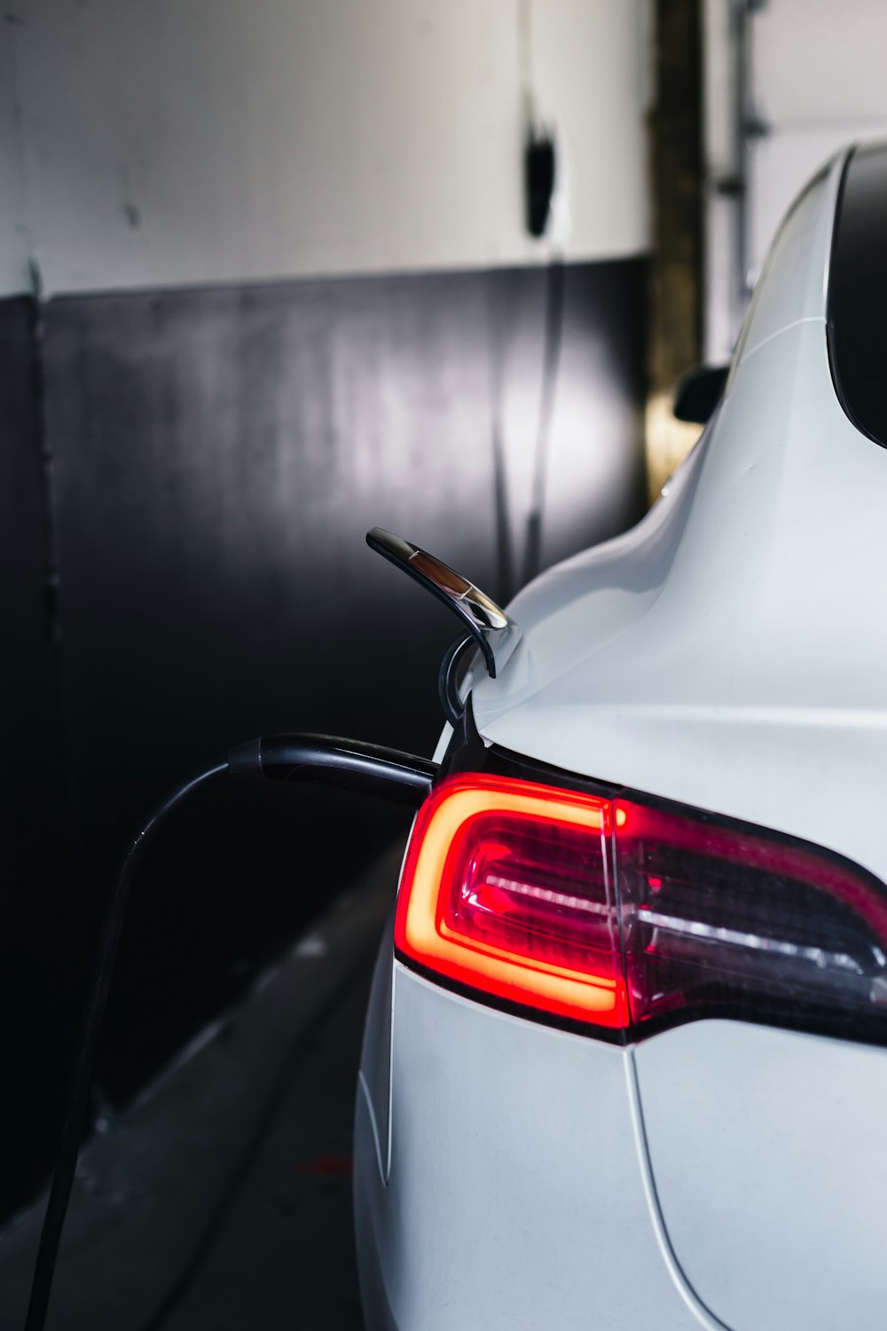 the tail light of a white car is shown
