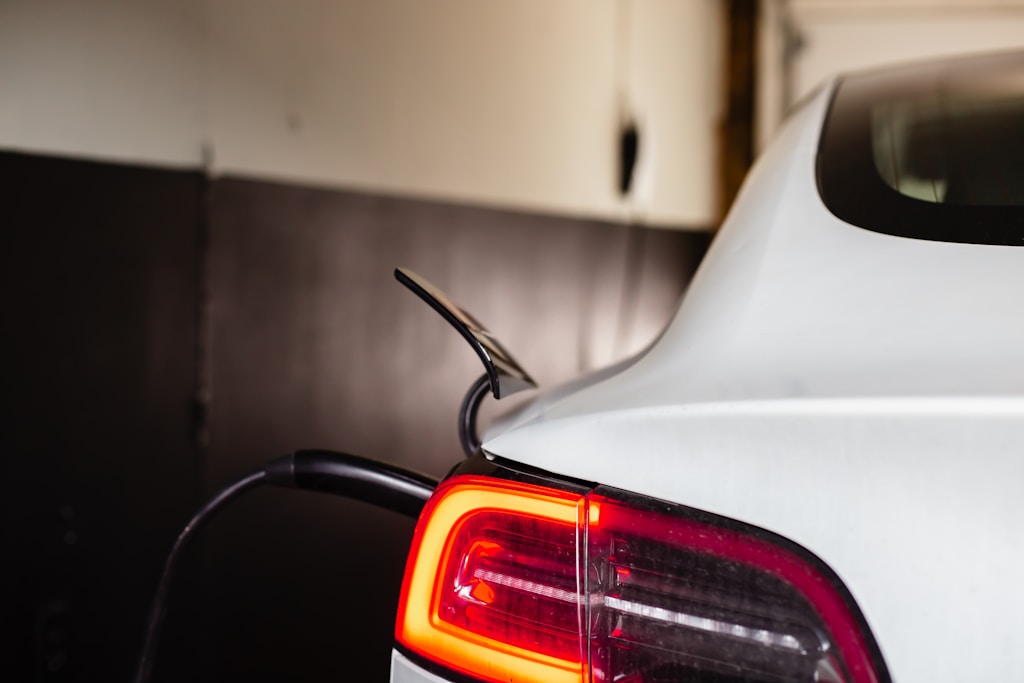the tail light of a white car in a garage