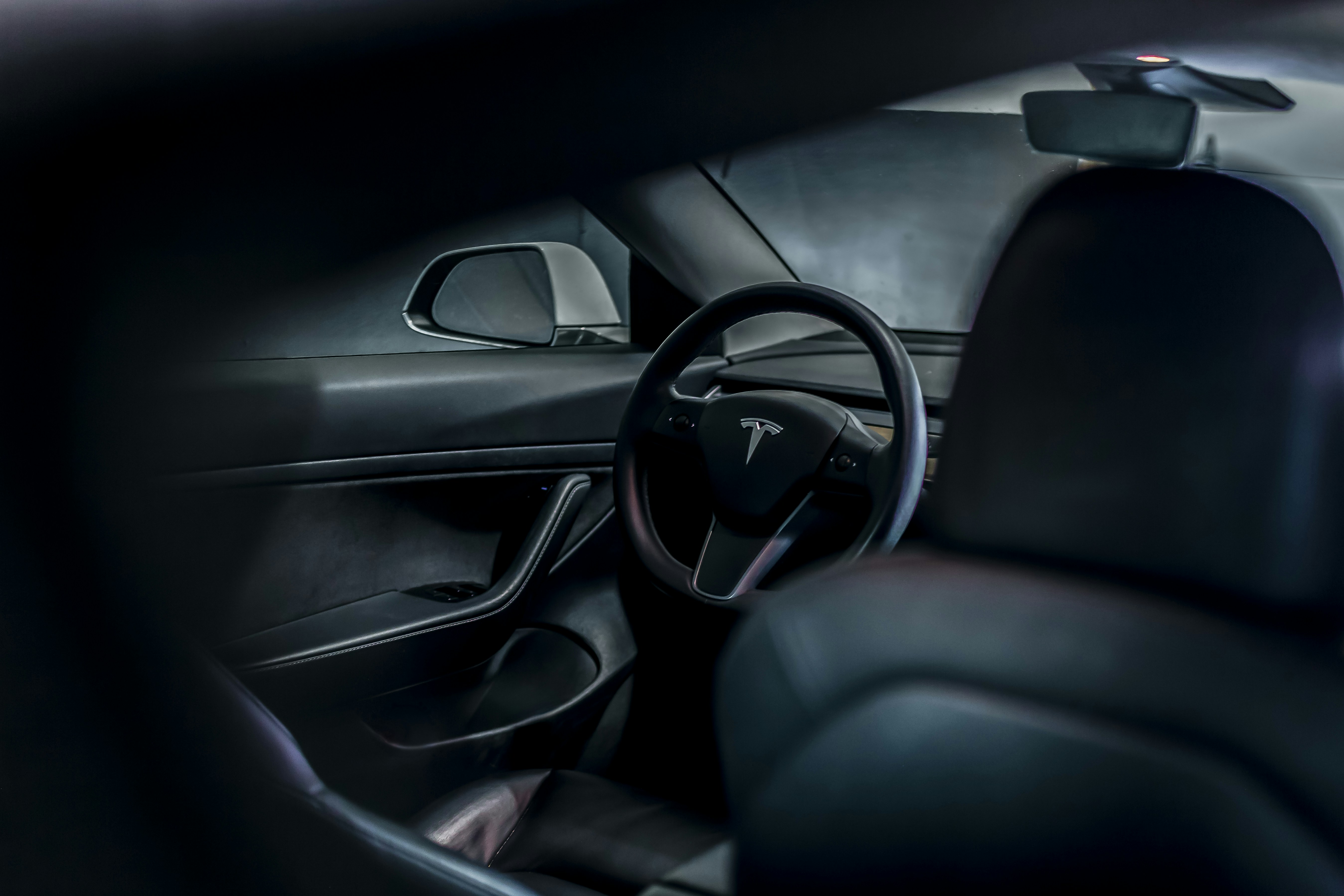 Tesla Model S interior screen showing Autopilot and FSD controls on the center display