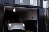 a white car is parked in a garage