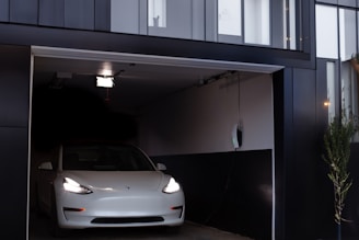 a white car is parked in a garage