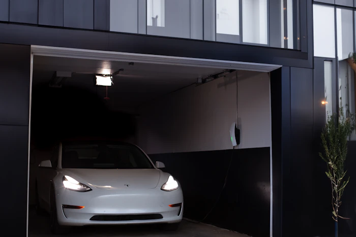 Home garage design with car parked inside