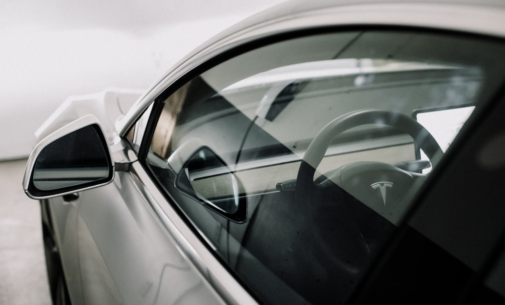 a close up of a car's side view mirror