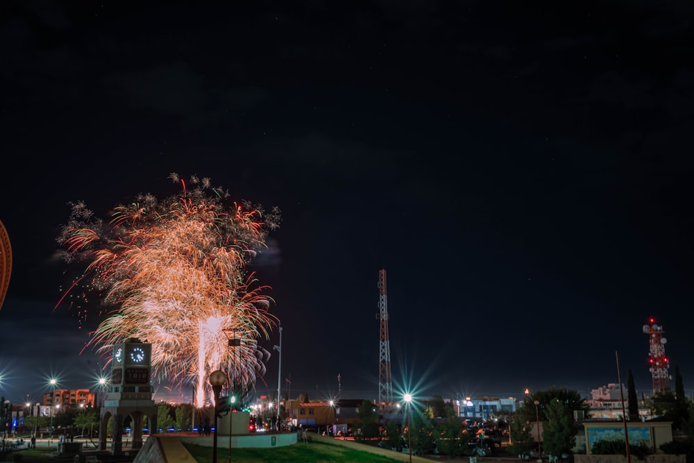 fireworks are lit up in the night sky