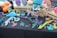 A display table is filled with colorful 3D-printed objects, including dragons, lizards, and a turtle. The items are multi-colored with shades of purple, teal, pink, and yellow. There are also carved wooden names and phrases and potted succulents. Additionally, Halloween-themed pumpkin decorations are visible, mingling with crafting tools on the side.