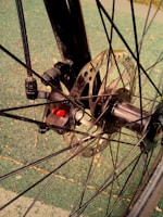 Electric bike wheel with tire tread pattern and disc brake visible