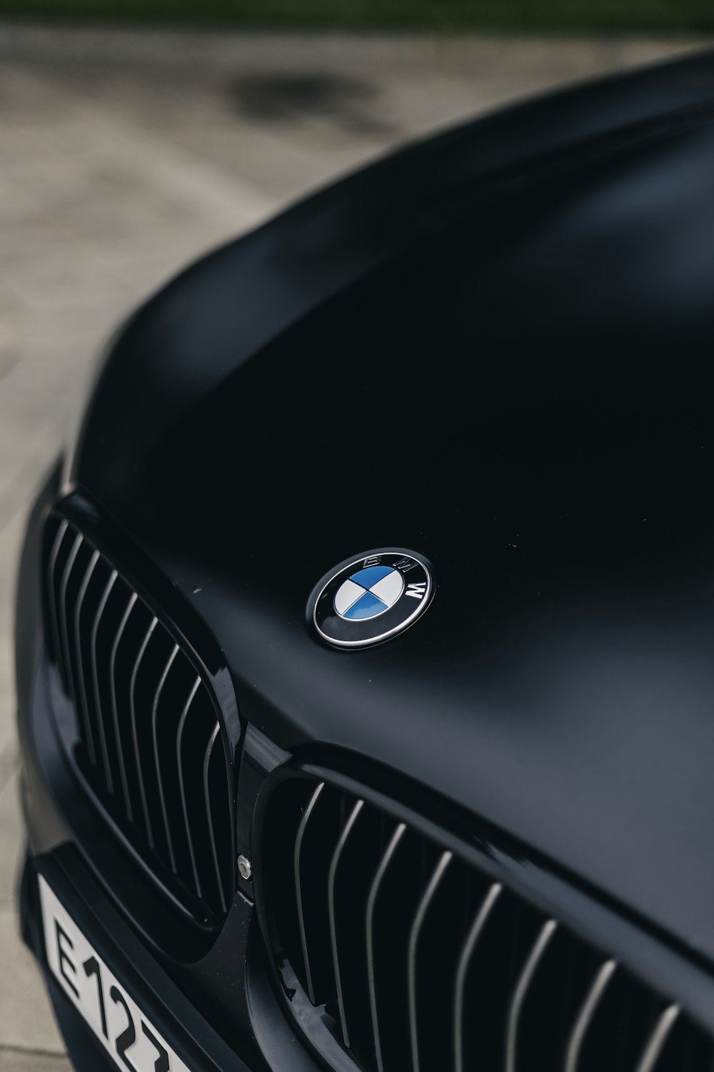 the front end of a black bmw car