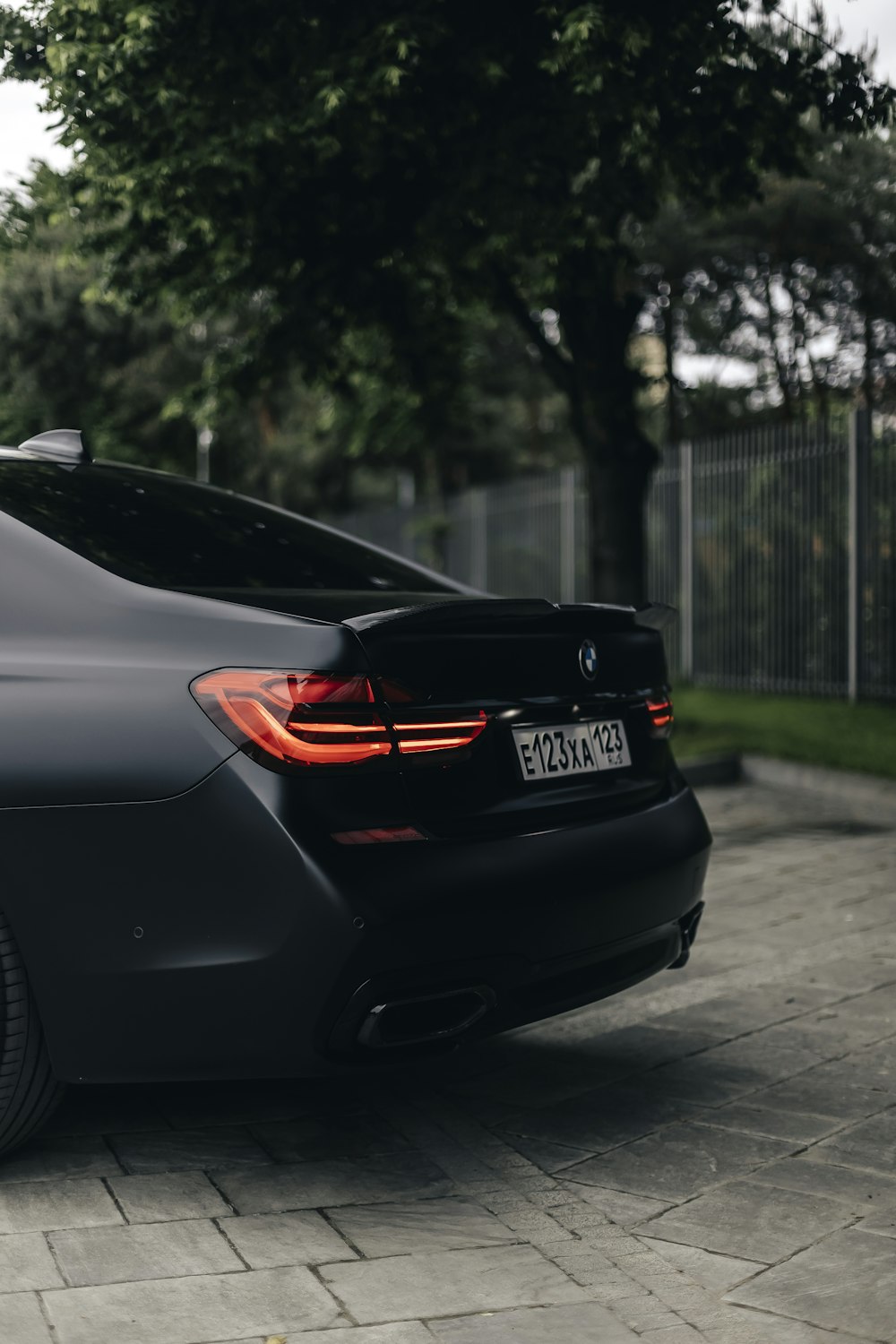 a black car parked on the side of the road