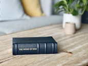 a blue book sitting on top of a wooden table