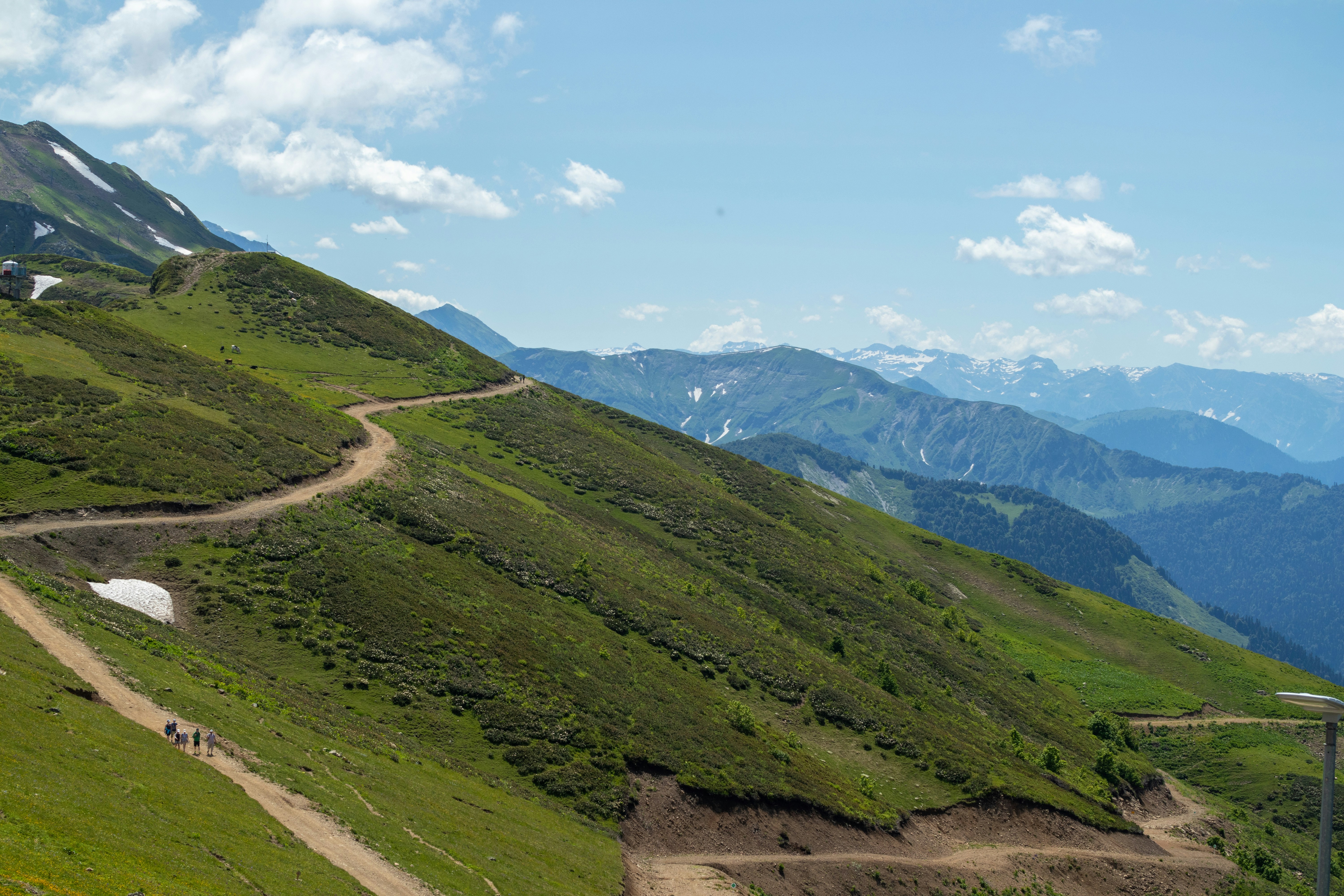 a dirt road going up the side of a mountain