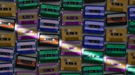 An artistic shot of a cassette tape with colorful labels.