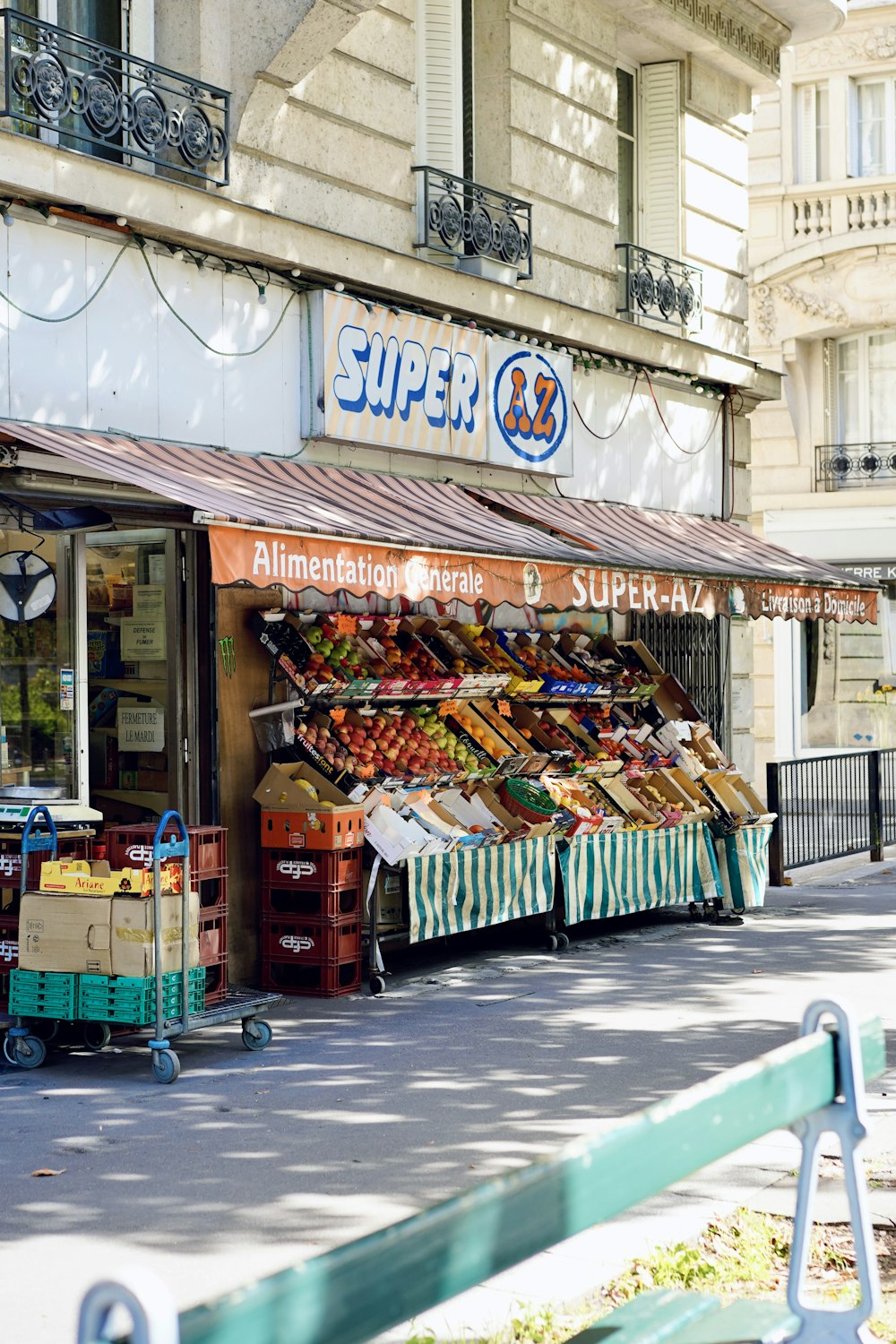 a store front with a variety of fruits and vegetables