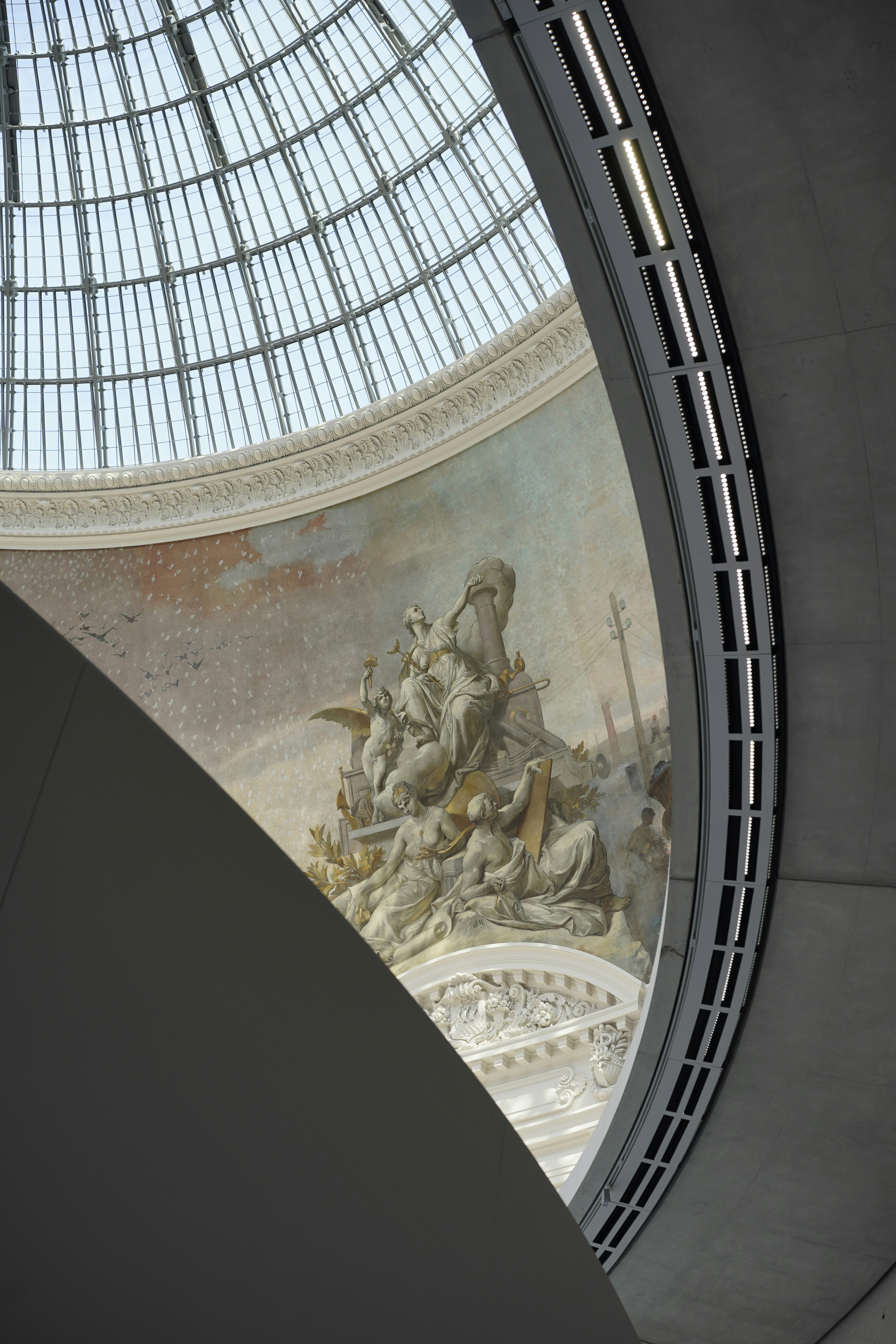the ceiling of a building with a painting on it