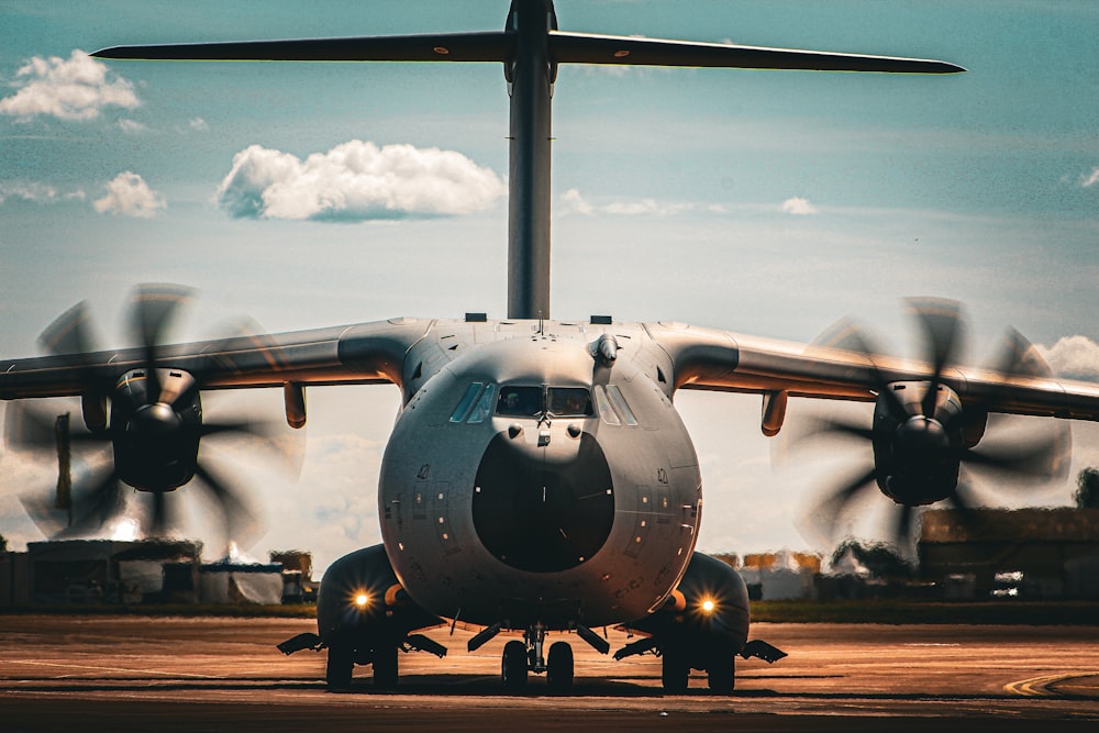 a large air plane sitting on top of an airport tarmac