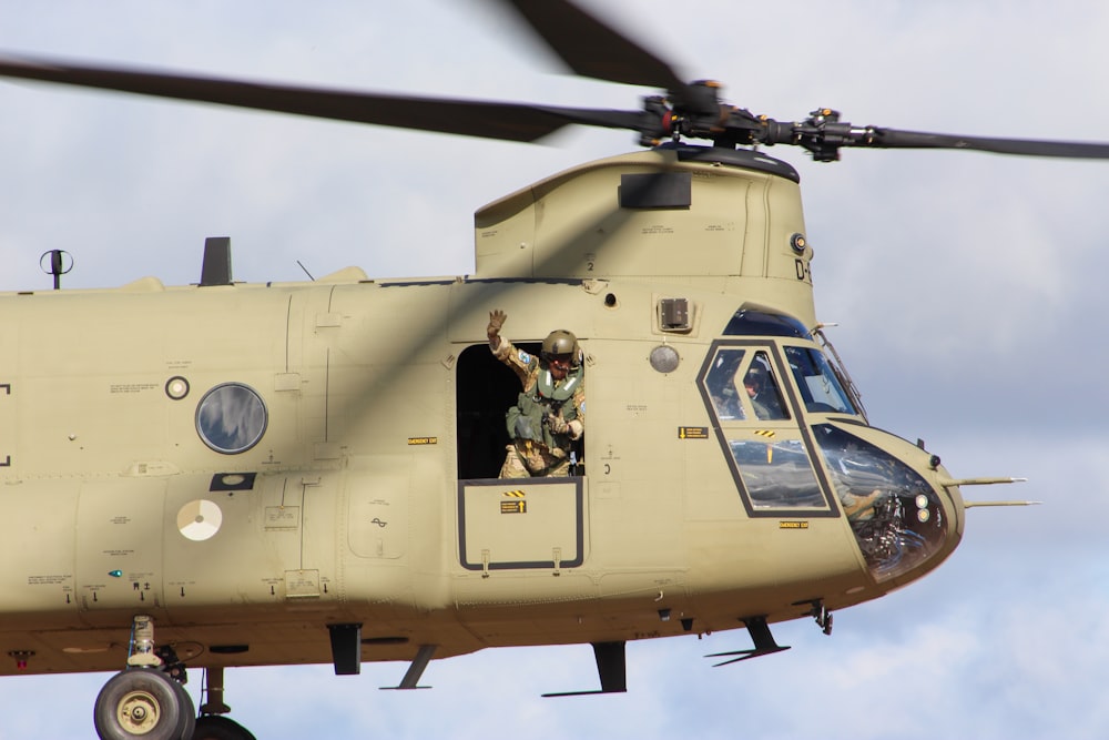 a helicopter with two people inside of it