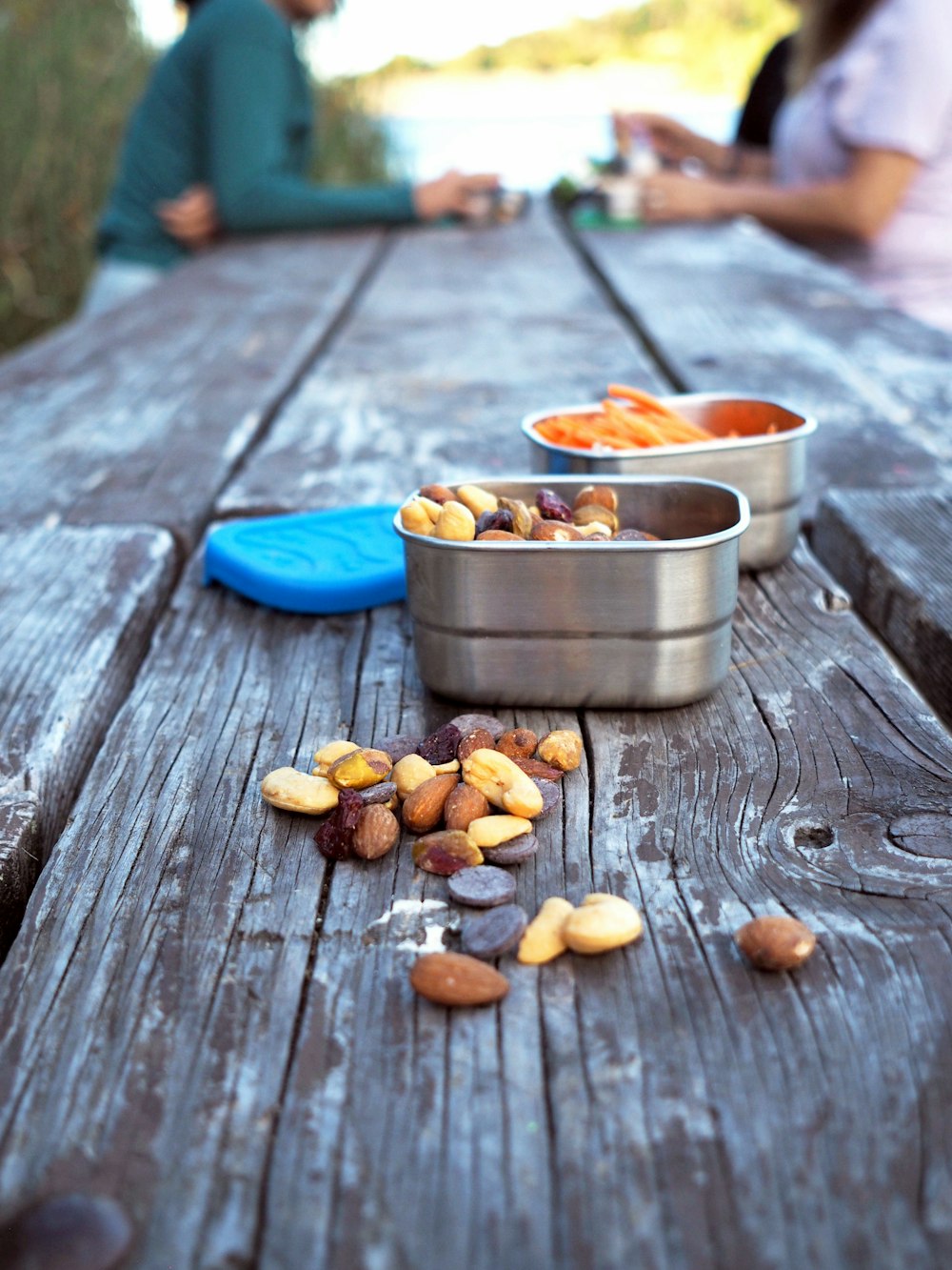 a couple of tins sitting on top of a wooden table