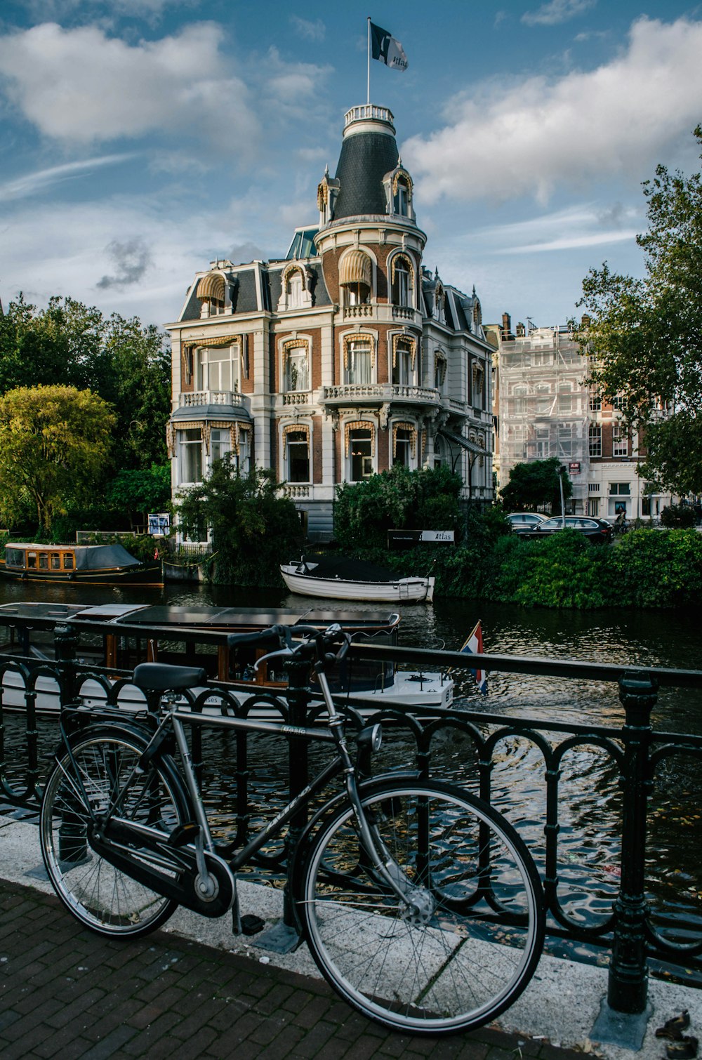 two bikes parked next to each other on a bridge