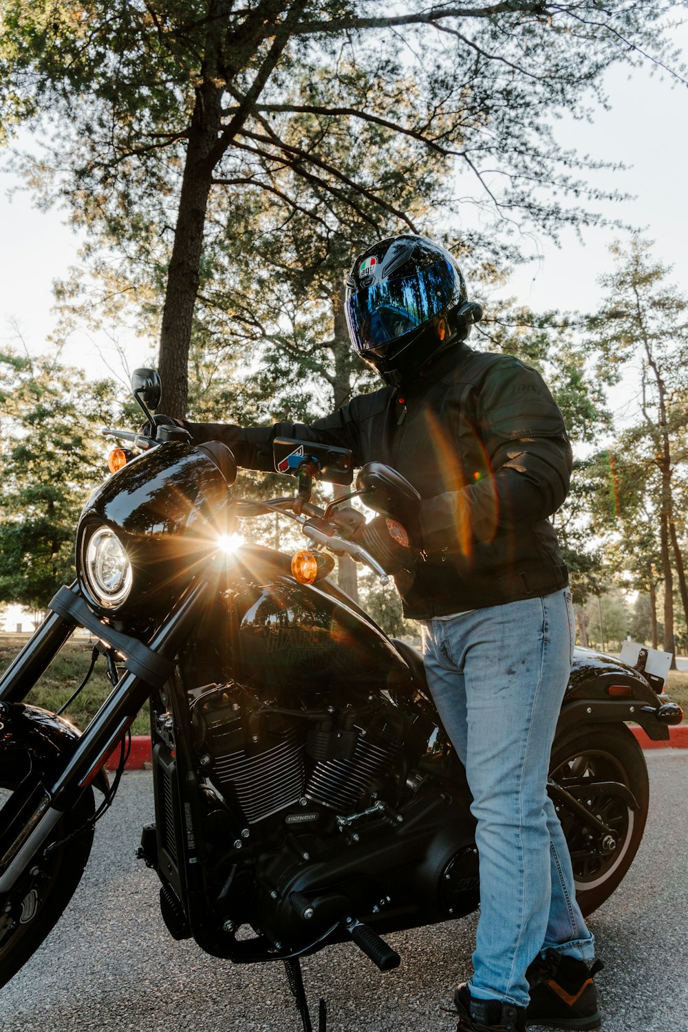 a man standing next to a parked motorcycle