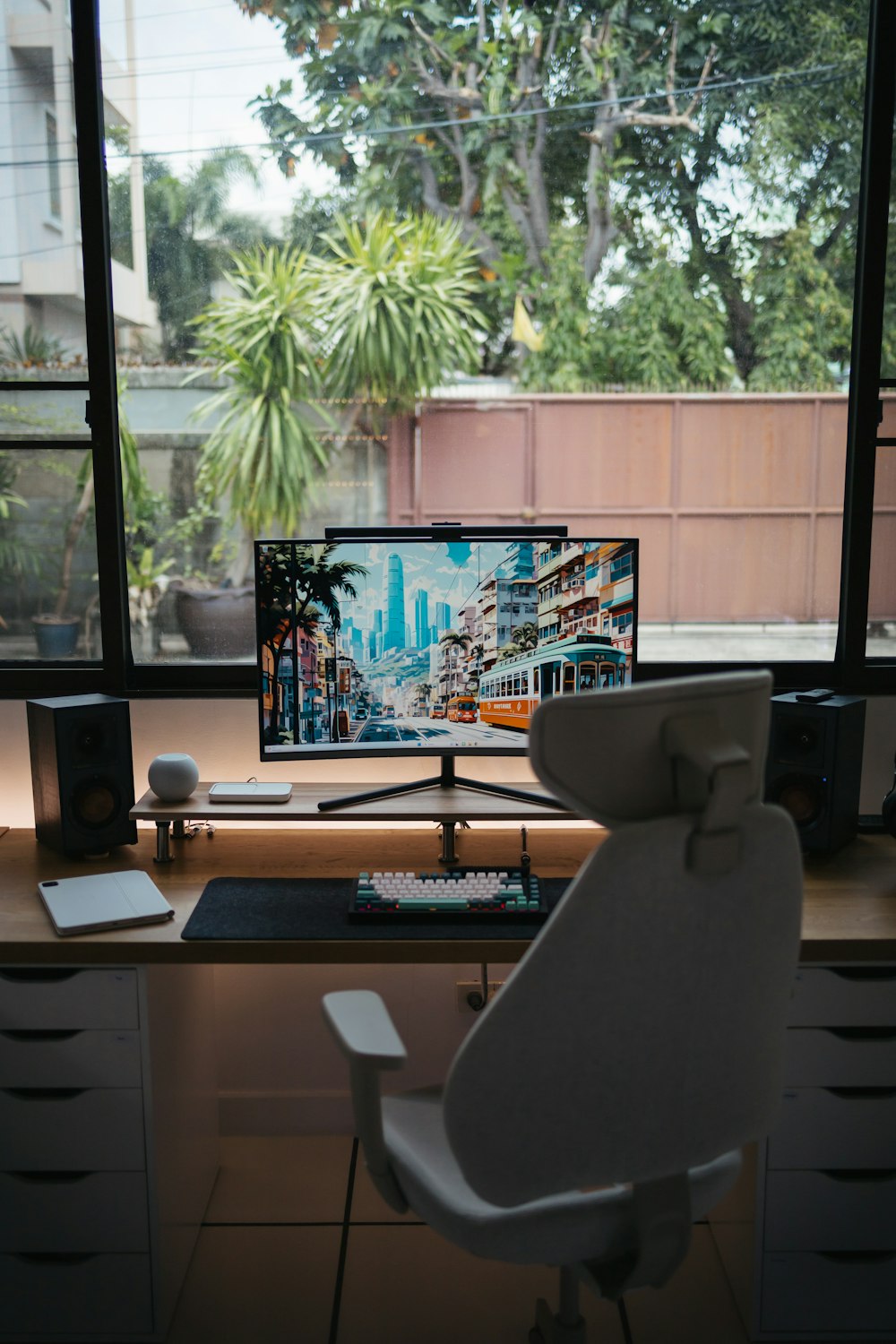 a computer monitor sitting on top of a wooden desk