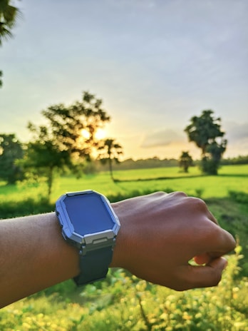 An outdoor scene of a creator jogging at dawn, showcasing a fresh, groomed look with a minimalist wristwatch.