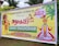 A colorful banner promoting an event called Grand Onaghosham, featuring traditional Kerala imagery including a Kathakali dancer and a mythological figure with an umbrella. The event is set for September 17, 2023, and includes cultural programs. The background includes palm trees and decorative elements.