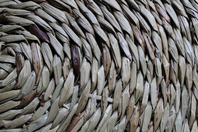 Close-up of a handwoven natural jute bag with intricate patterns and earthy tones.