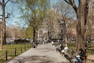A family enjoying a sunny day in a beautiful Spanish park.