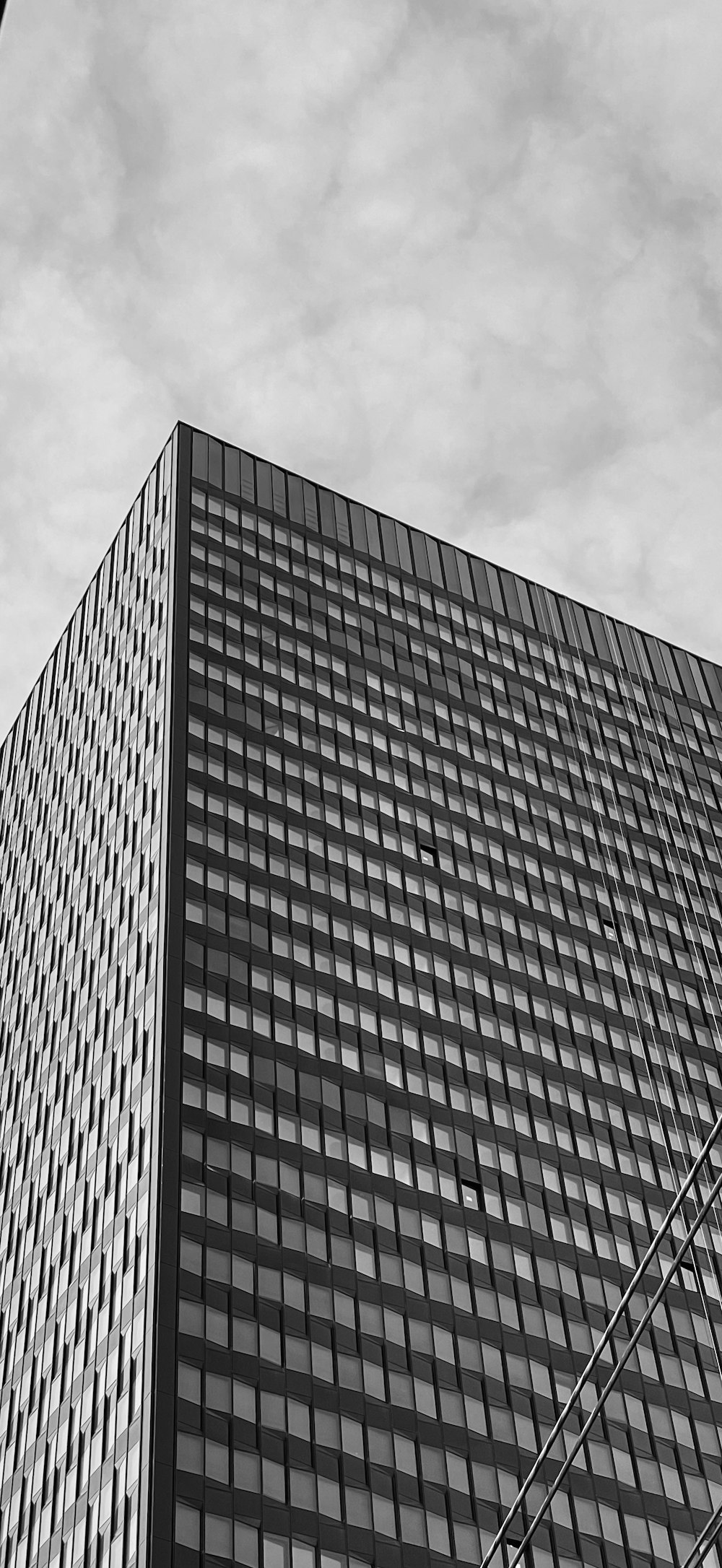 a black and white photo of a tall building