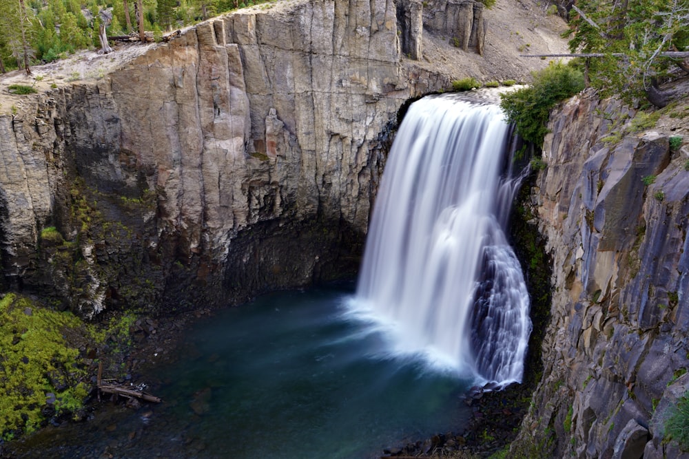 a waterfall with a large waterfall coming out of it