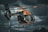 A helicopter is flying against a dramatic cloudy sky backdrop. The helicopter has a sleek design with a primarily dark body accented by orange elements. The image conveys a sense of motion with the rotors blurred in action.