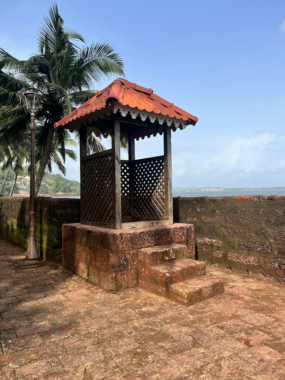 a small gazebo sitting on top of a dirt field