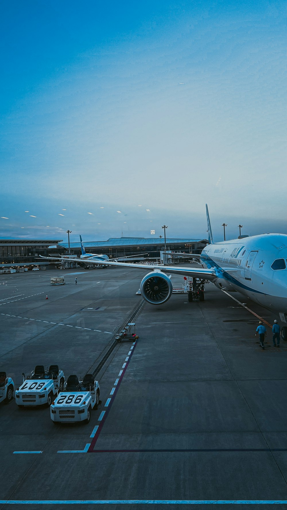 a large jetliner sitting on top of an airport tarmac