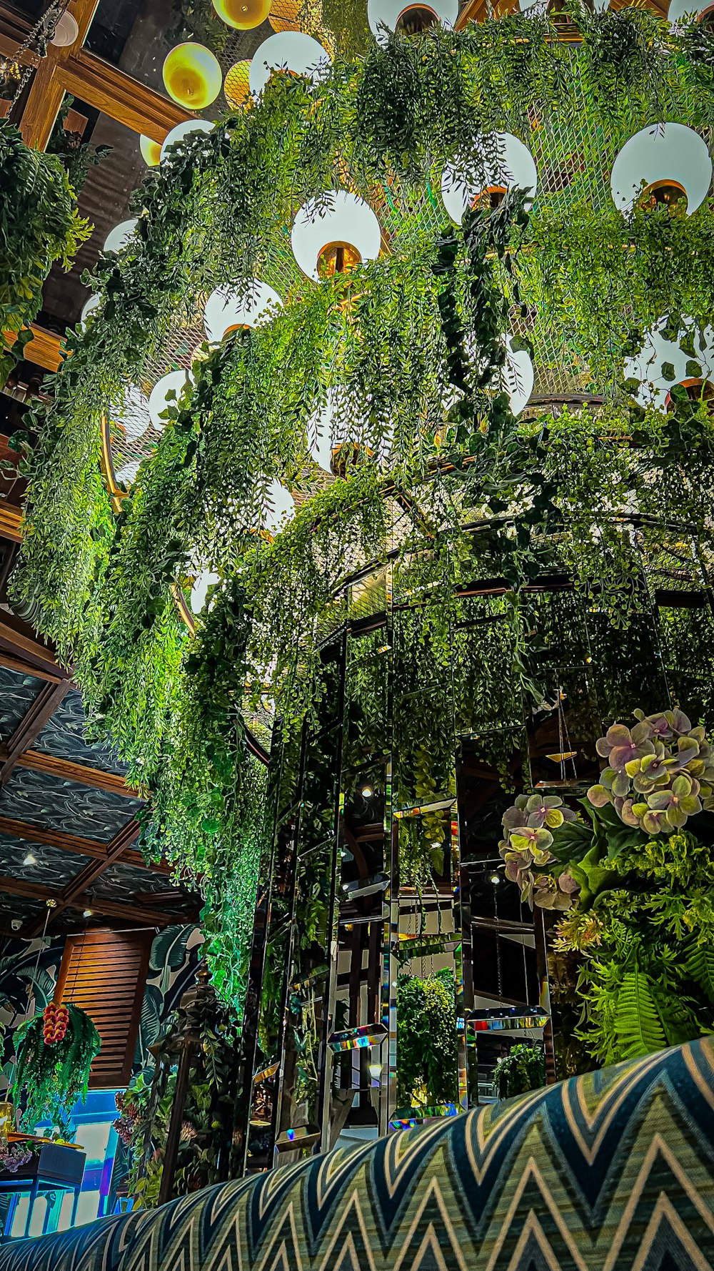 a room filled with lots of green plants