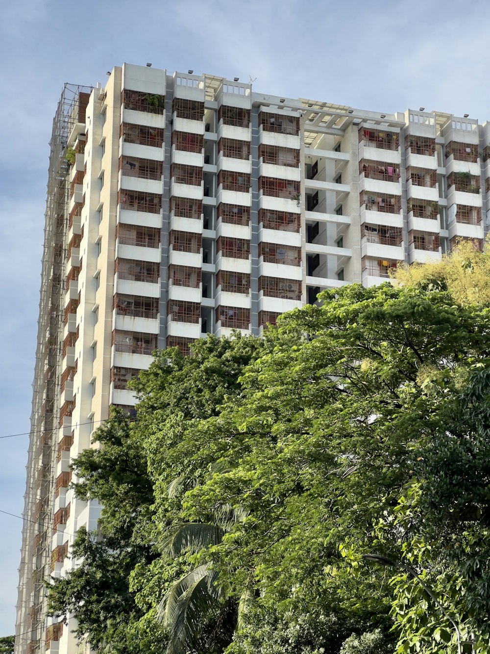 a very tall building with lots of windows and balconies