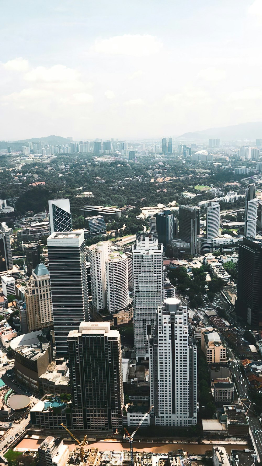 an aerial view of a city with tall buildings