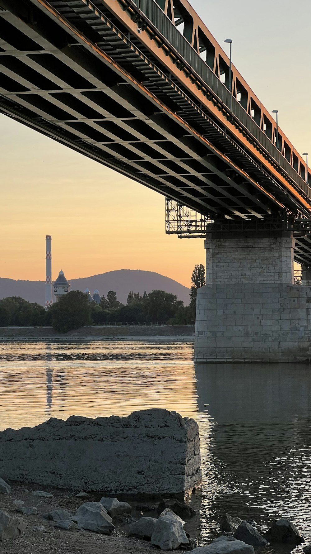 a train crossing a bridge over a body of water