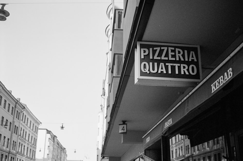 a black and white photo of a street corner