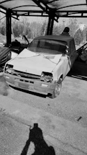 A car with hail damage being assessed for repair.